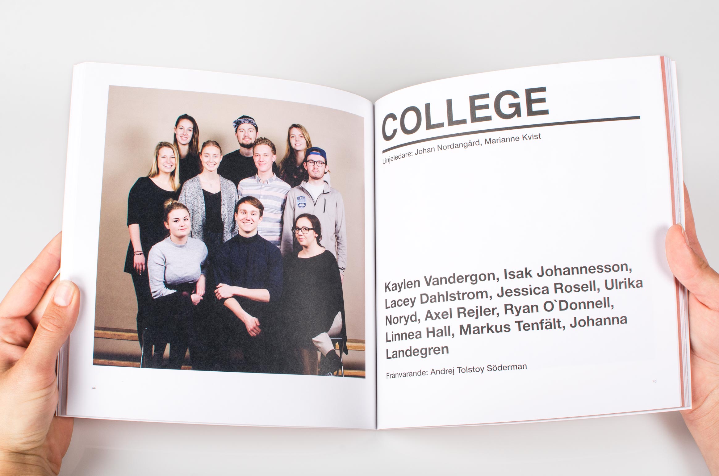 Hands holding up the "College" inner spread