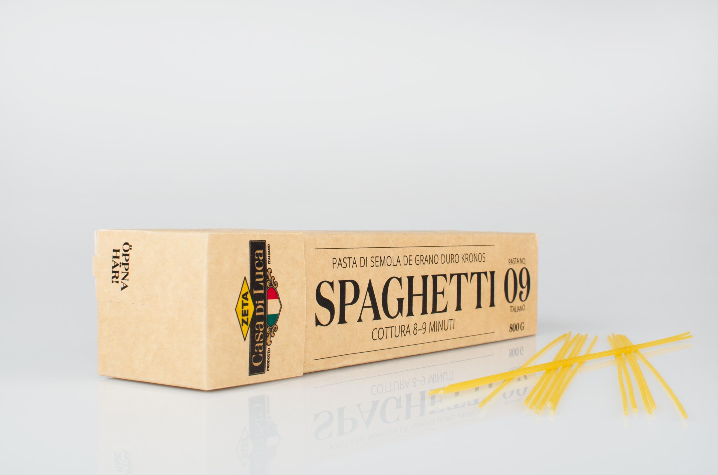 a package of spaghetti lying down with noodles on the side